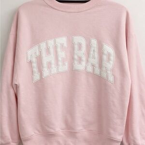 The Bar Pink Crewneck Sweatshirt with White Lettering